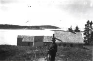 caption: The artist working on the canvas at Eight Bells, Port Clyde, Maine (Brandywine River M…