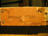 caption: Label in the artist's hand affixed to stretcher. Photo courtesy of Joyce Hill Stoner.