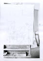 caption: Archival photograph showing easel with design drawn on canvas before addition of color…