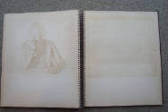 caption: "Ghost" image of drawing on opposite page of scrapbook in which drawing had been paste…