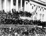 caption: Photograph by Alexander Gardner of Lincoln giving his second inaugural speech.